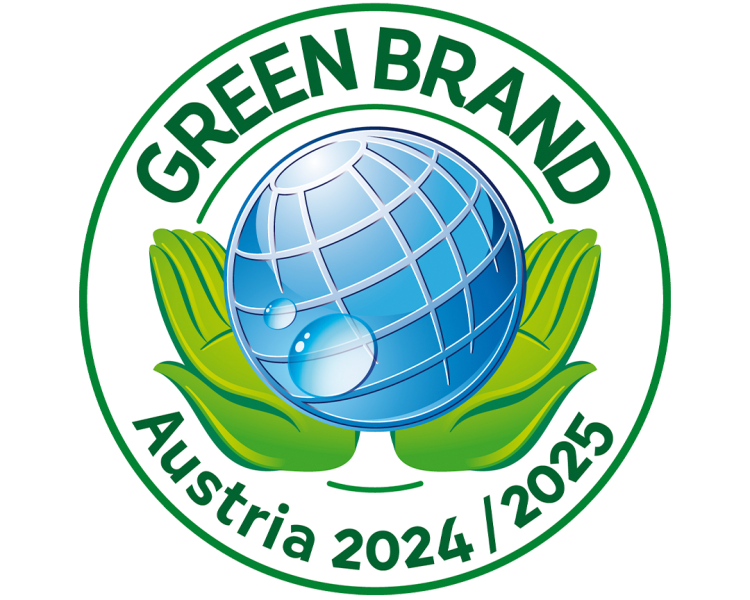 Two hands hold a ball. Brand Green Brand Austria 2024/2025